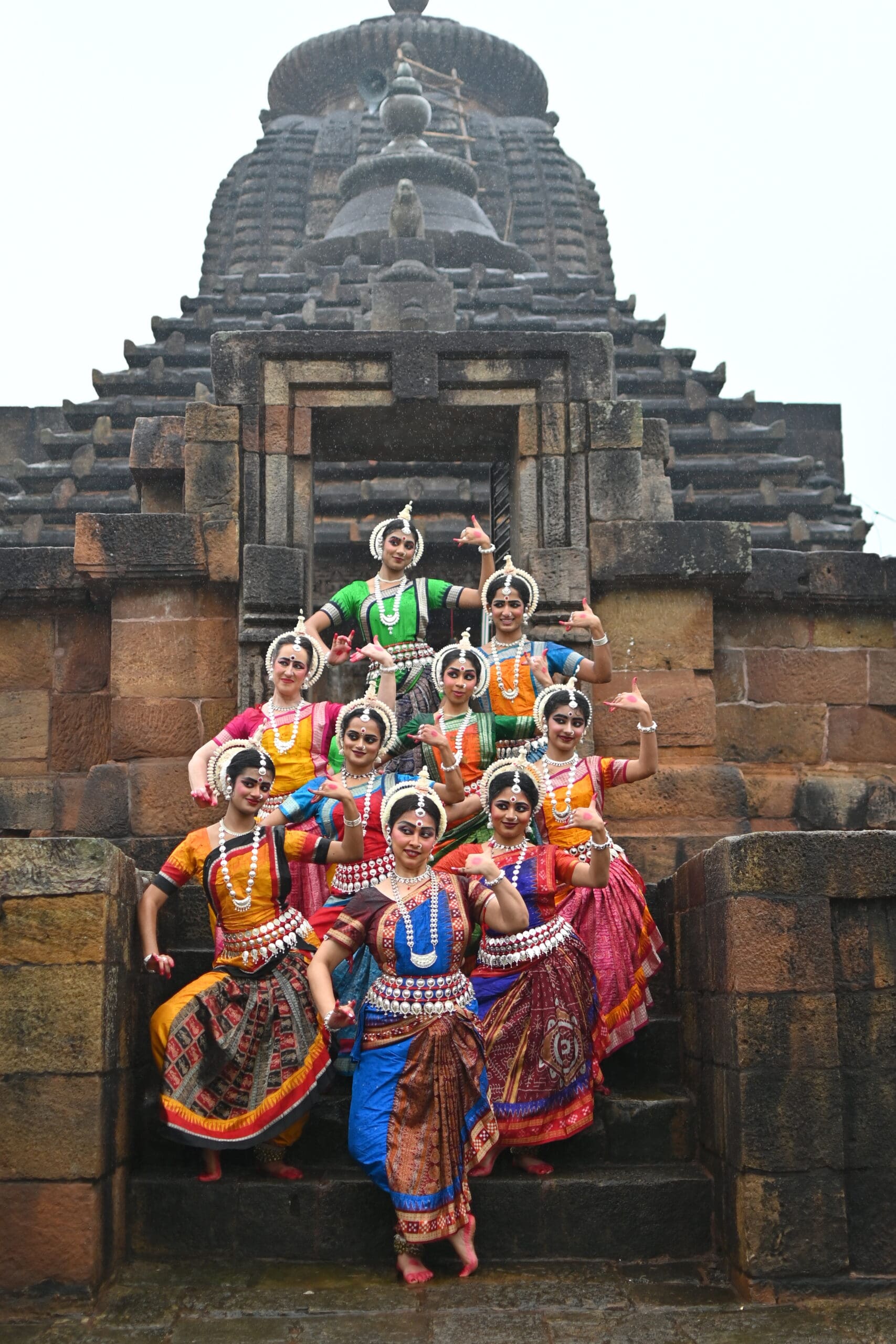 Odissi Indian classical dance image in front of temple - more dynamic pose